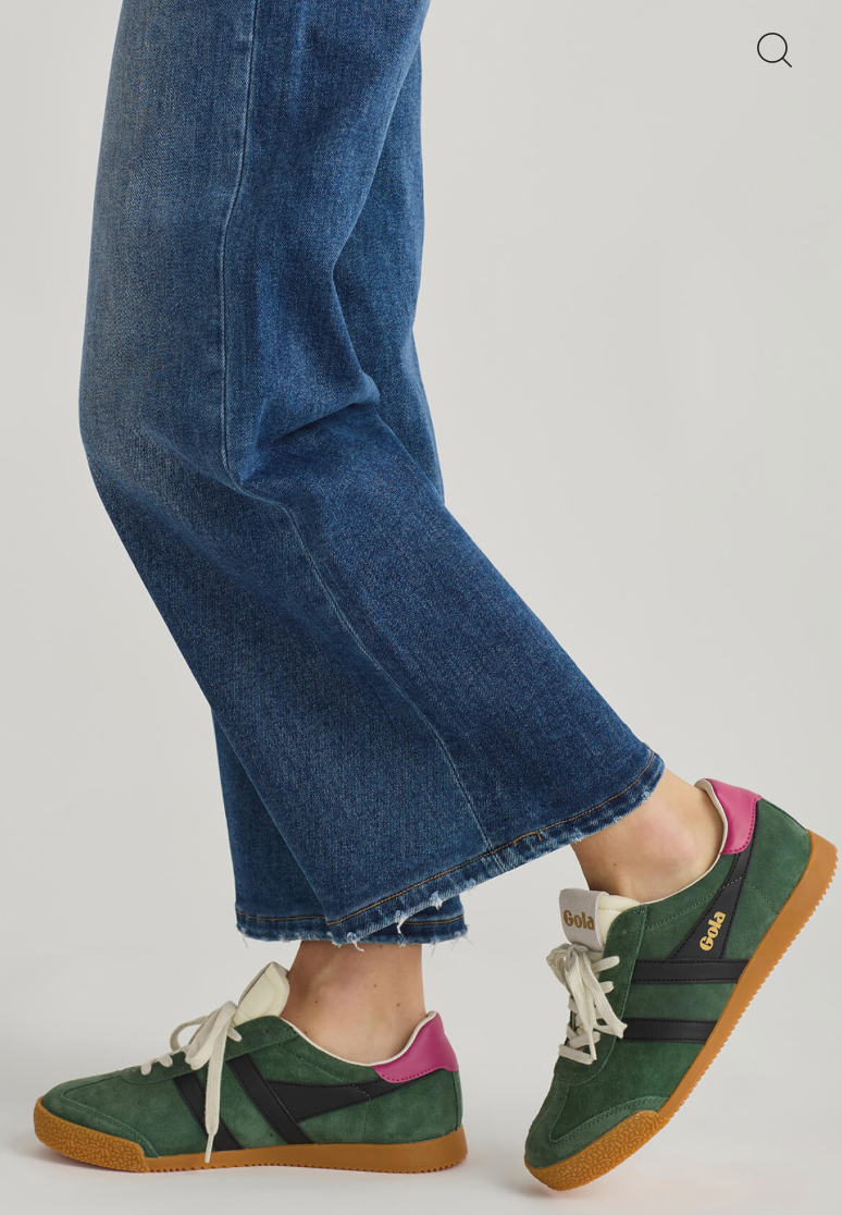 classic green suede Gola sneakers with black stripes, white laces, gum sole, and purple heel tab.