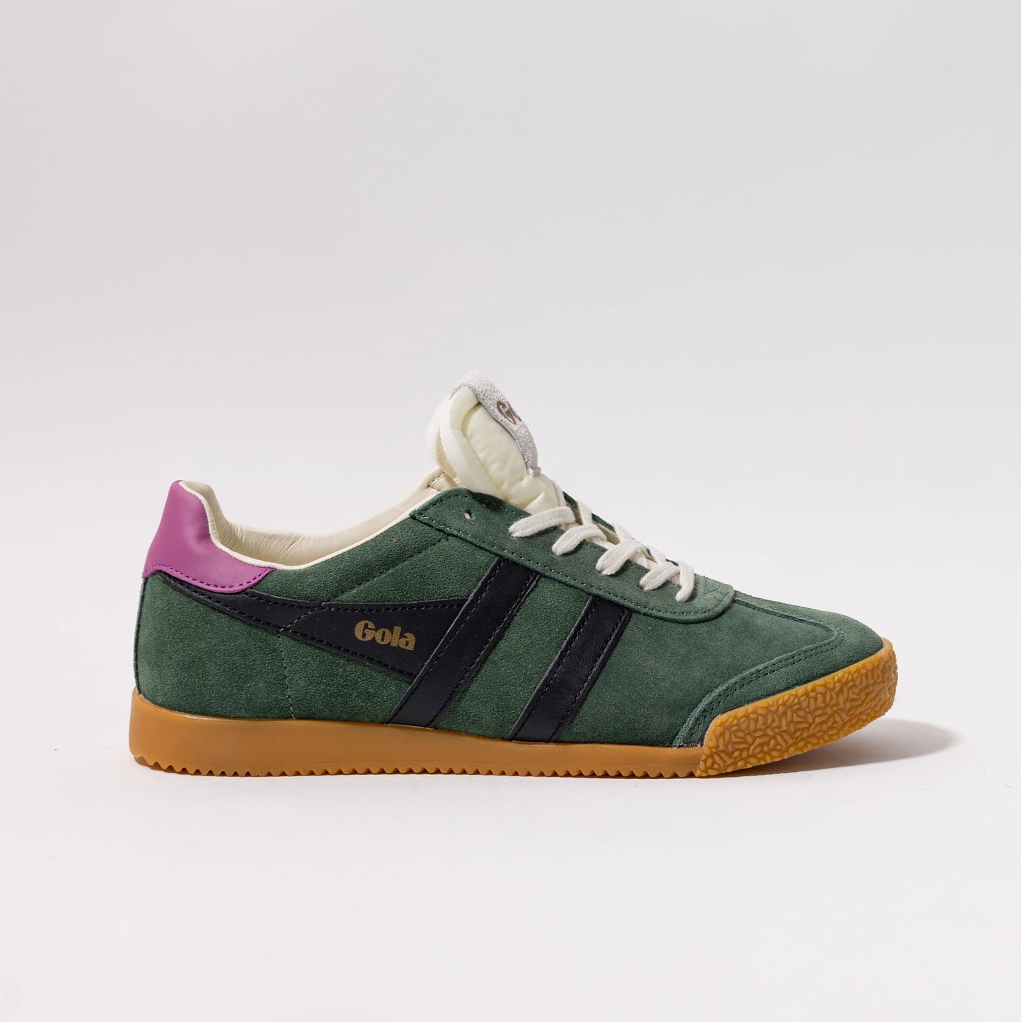 classic green suede Gola sneakers with black stripes, white laces, gum sole, and purple heel tab.