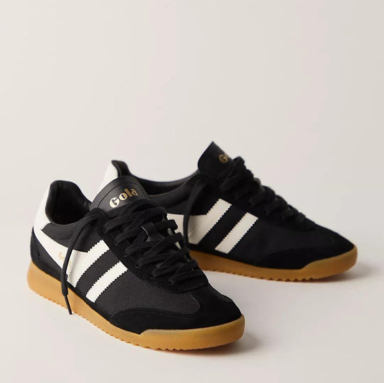 a black gola Torpedo sneaker with white strtipes and a retro gum sole with black laces