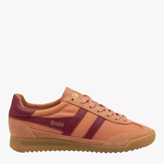 Side view of a Gola Tornado sneaker featuring a terracotta canvas and suede upper, burgundy leather stripes, gold Gola branding, and a gum rubber sole.