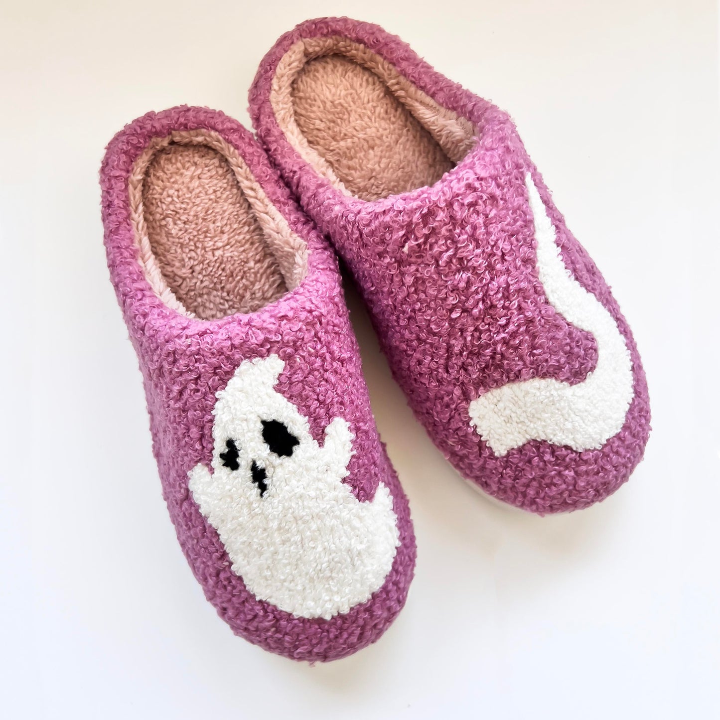 Cozy purple ghost slippers featuring a cute white ghost design, perfect for keeping your feet warm and comfortable