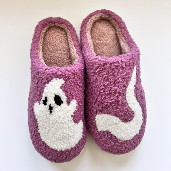 Cozy purple ghost slippers featuring a cute white ghost design, perfect for keeping your feet warm and comfortable