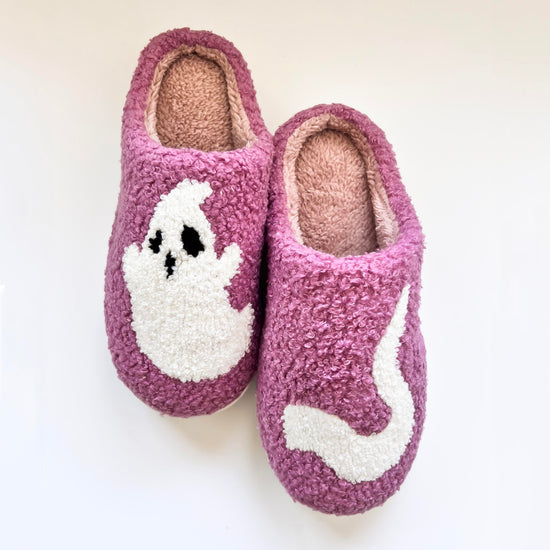 Cozy purple ghost slippers featuring a cute white ghost design, perfect for keeping your feet warm and comfortable