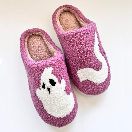 Cozy purple ghost slippers featuring a cute white ghost design, perfect for keeping your feet warm and comfortable