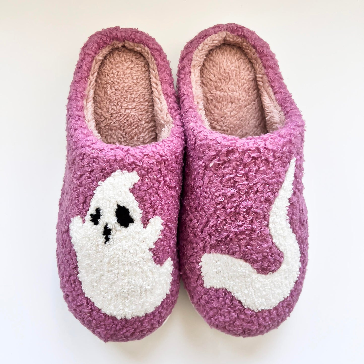 Cozy purple ghost slippers featuring a cute white ghost design, perfect for keeping your feet warm and comfortable