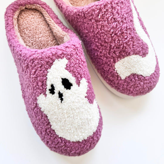 Cozy purple ghost slippers featuring a cute white ghost design, perfect for keeping your feet warm and comfortable