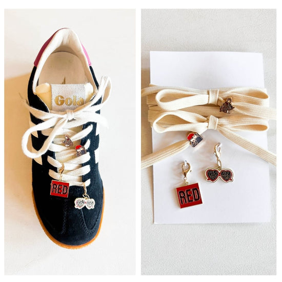 Sneaker with custom Swiftie-themed charms on cream-colored laces, featuring a 'RED' square charm, heart-shaped sunglasses charm, and two additional playful designs displayed next to extra laces.