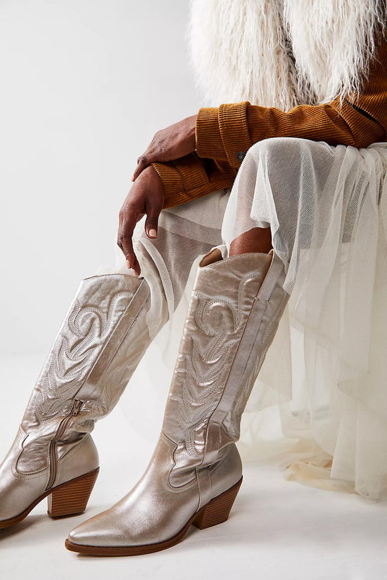 Metallic platinum western cowboy boots with embroidered detailing, pointed toe, and mid-block heel for women