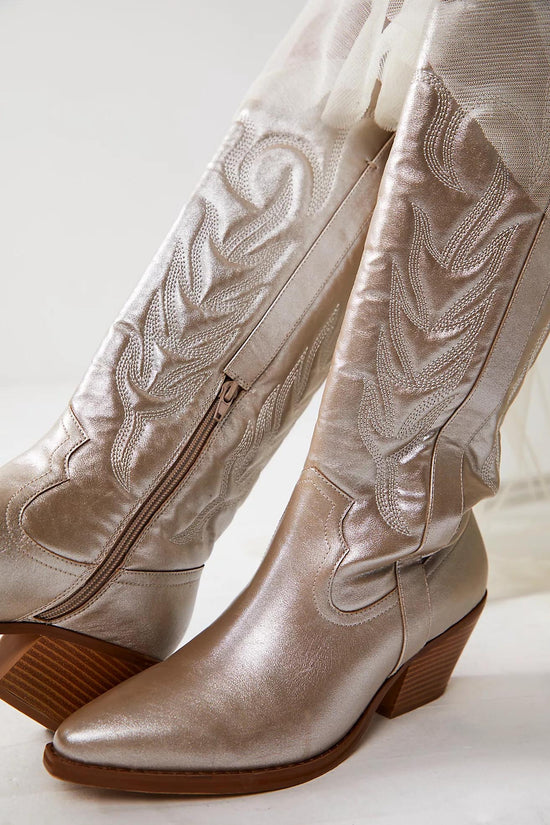 Metallic platinum western cowboy boots with embroidered detailing, pointed toe, and mid-block heel for women