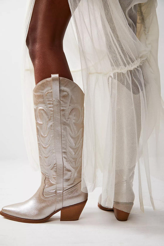 Metallic platinum western cowboy boots with embroidered detailing, pointed toe, and mid-block heel for women