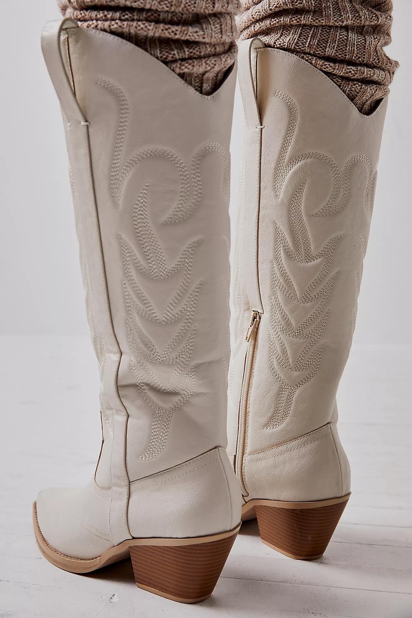 White vegan leather embroidered western cowboy boots with a pointed toe and mid-heel for women