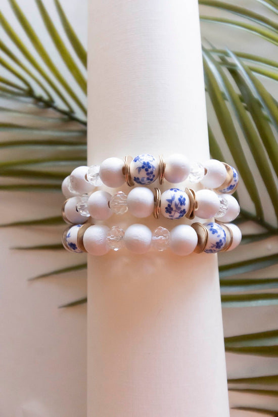 Load image into Gallery viewer, Lena Bracelet Stack | White Painted Wood Beads | Blue China Patter Beads | Spring Summer Bracelet Stacks | Layering Bracelets
