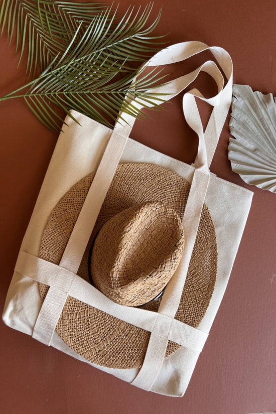 Load image into Gallery viewer, Hat Carrying Tote Bag | Large Neutral Beach Towel Travel Tote | Built In Straps for Carrying Hat
